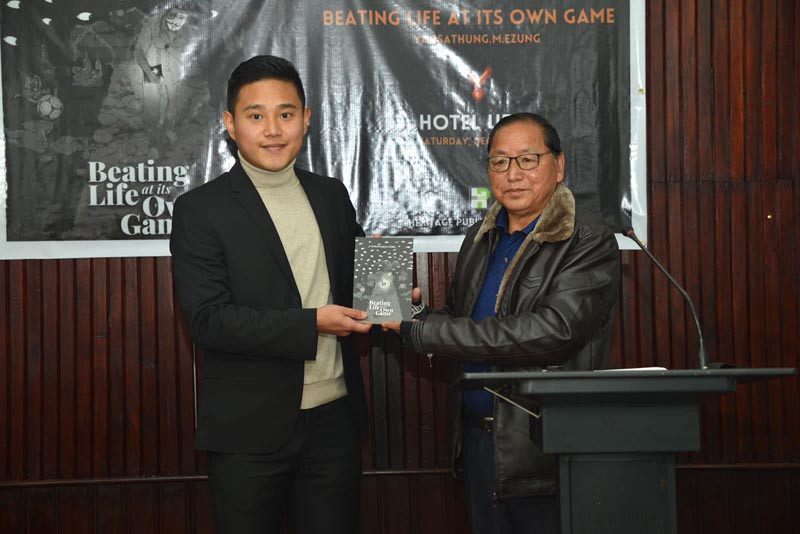 Pankathung Lotha, Chairman, Kohima, Lotha Hoho releasing Yansathung M Ezung’s debut book, “Beating Life at its Own Game” at Ura hotel, Kohima on December 4.